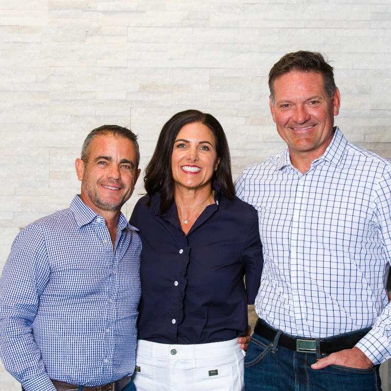 The Hobert family owners standing together and smiling.